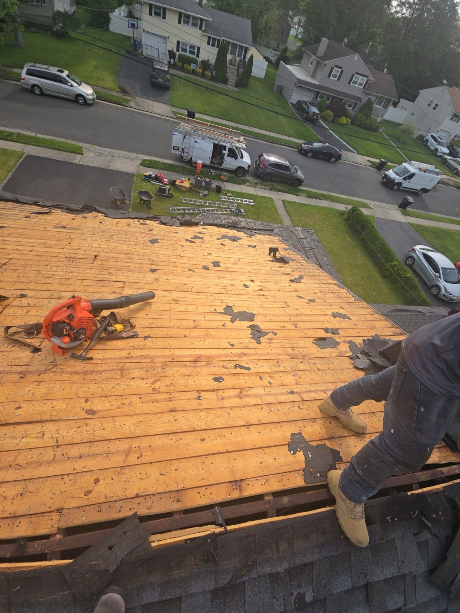 Paterson, NJ asphalt shingle roof replacement in progress — full tear-off to decking by Zubar Roofing.