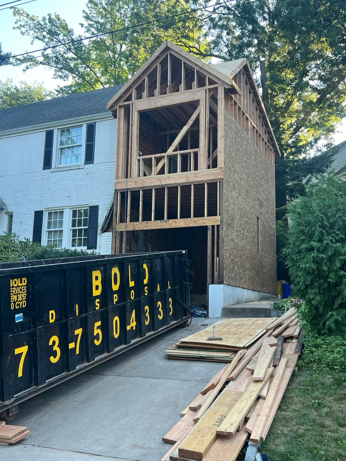 Dormer addition framing during new-construction roofing in New Jersey by Zubar Roofing.