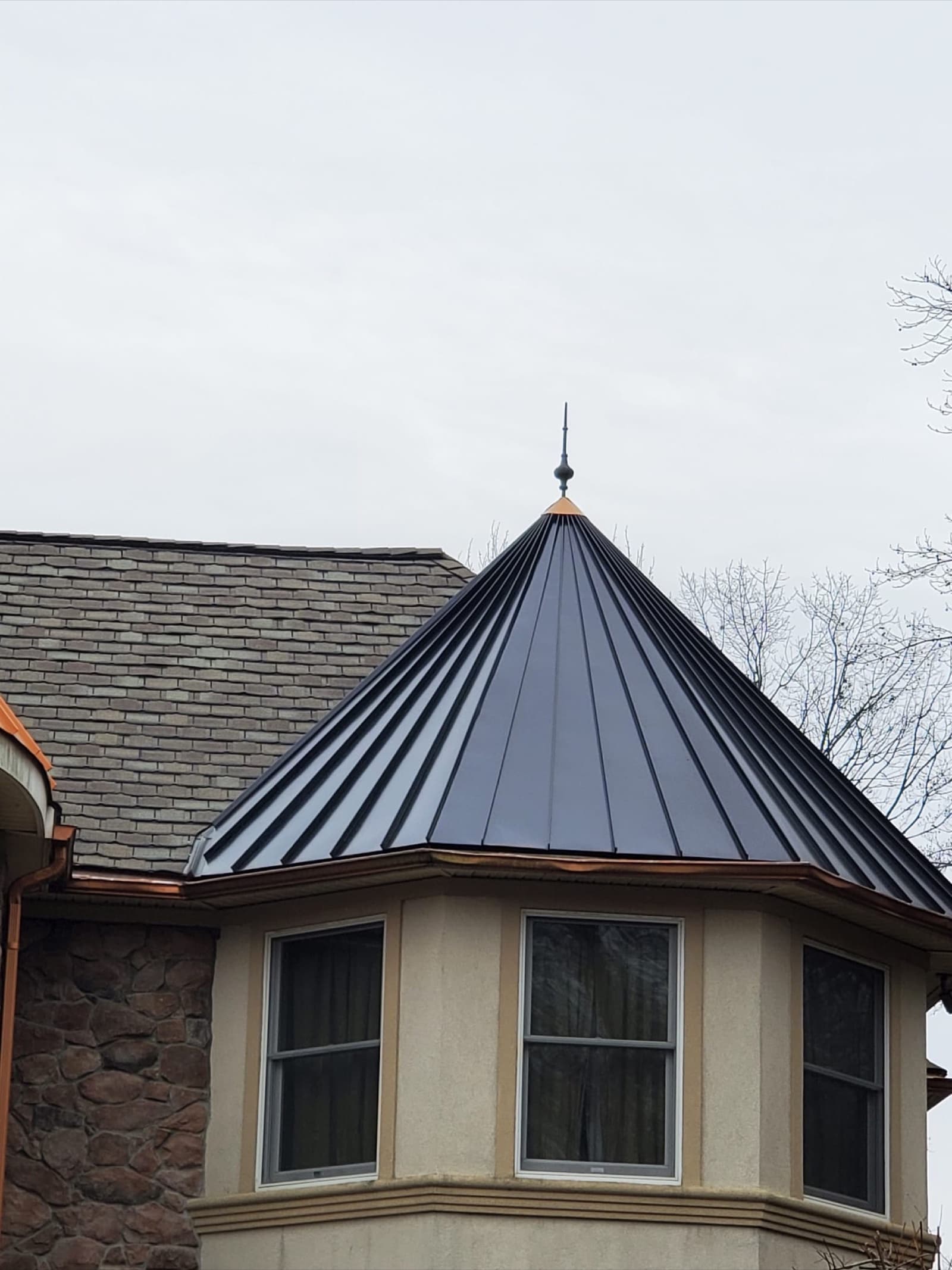 Black standing-seam metal roof on a turret and cupola — custom metal roofing by Zubar Roofing in New Jersey.