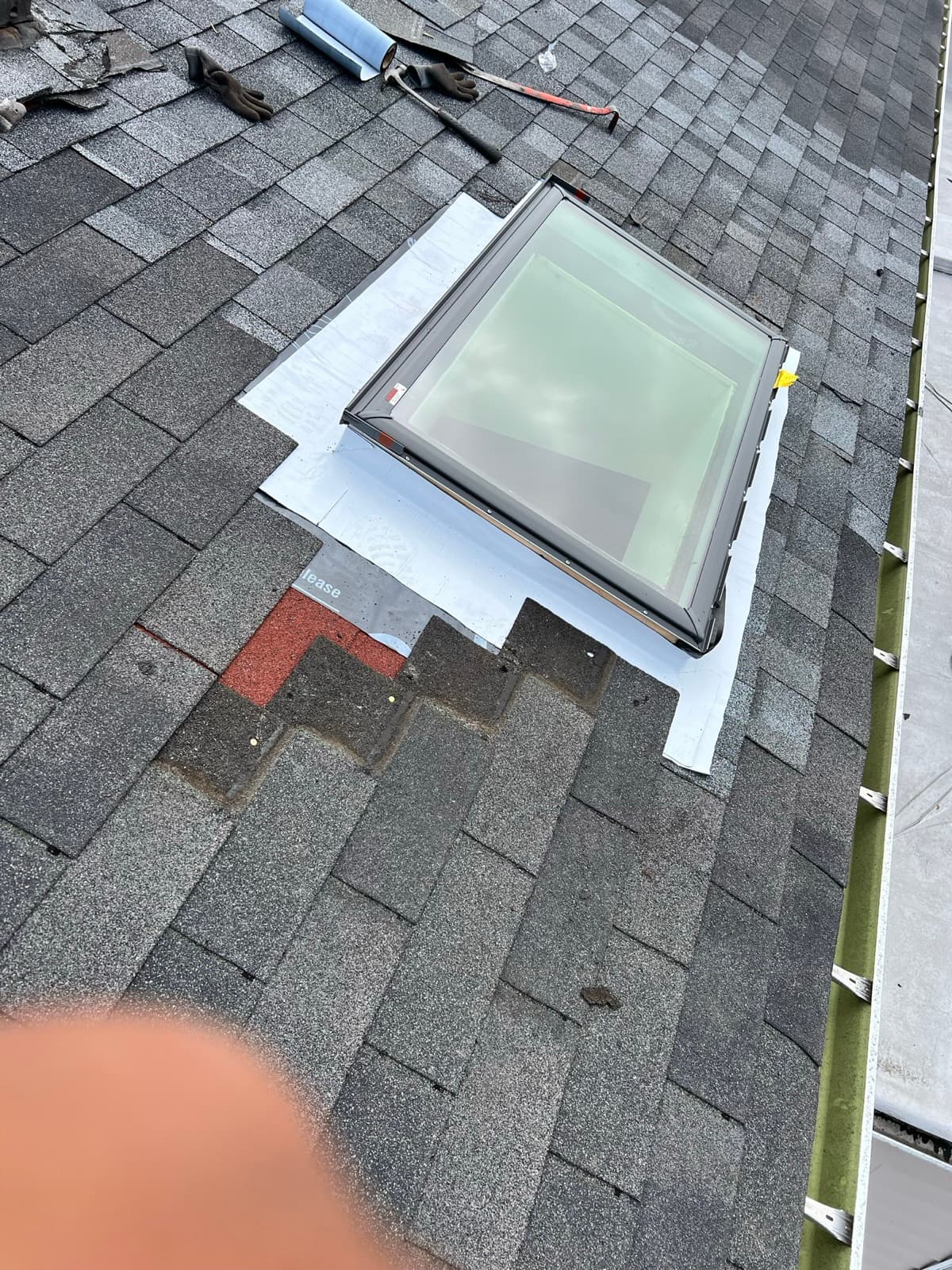 Velux skylight installed in an architectural shingle roof in New Jersey by Zubar Roofing.