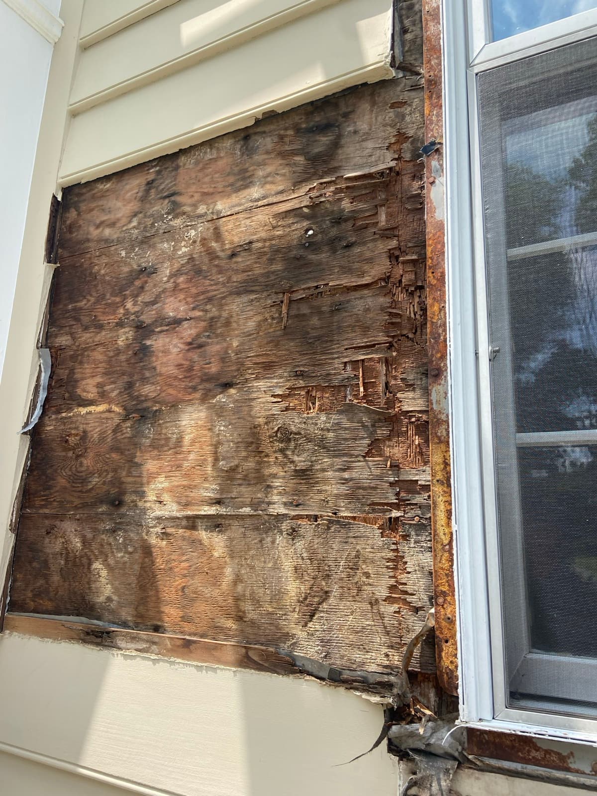 Water-damaged sheathing exposed and replaced during a New Jersey roof repair by Zubar Roofing.